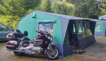 Honda Goldwing motorcycle near big camping tent